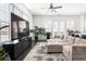 Spacious living room featuring lots of windows and natural light, hardwood floors, and modern decor at 3905 Danube Ln # 215, Atlanta, GA 30339