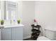 Modern powder room featuring a stylish vanity, sink, mirror, and a convenient storage cart at 3905 Danube Ln # 215, Atlanta, GA 30339
