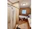 Bathroom with tub, shower with glass doors, and vanity with tiled walls at 698 Ira St, Atlanta, GA 30310