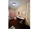 Bathroom with double vanity, tile flooring, and shower with maroon and white floral curtain at 698 Ira St, Atlanta, GA 30310