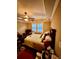 Bedroom with queen size bed, carpeted floor, large windows, and a sitting area at 698 Ira St, Atlanta, GA 30310