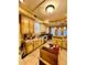 Traditional kitchen with wooden cabinets, tile backsplash and countertops and stainless steel appliances at 698 Ira St, Atlanta, GA 30310