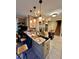 Traditional kitchen with stainless steel appliances, black kitchen island, and breakfast bar at 698 Ira St, Atlanta, GA 30310