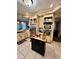 Traditional kitchen with stainless steel appliances and black kitchen island with butcher block countertop at 698 Ira St, Atlanta, GA 30310