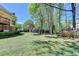 The yard features a trampoline and views of lush trees surrounding the property at 865 Mount Katahdin Trl, Johns Creek, GA 30022