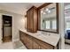 Bathroom featuring a double sink vanity, marble shower, and modern fixtures at 865 Mount Katahdin Trl, Johns Creek, GA 30022