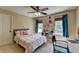 Cozy bedroom showcases a pink and white bed set, dual windows, and decor on the wall at 865 Mount Katahdin Trl, Johns Creek, GA 30022