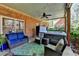 Cozy covered patio with comfortable seating and a hot tub, ideal for outdoor living at 865 Mount Katahdin Trl, Johns Creek, GA 30022