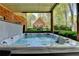 Inviting hot tub on a covered patio, perfect for relaxation and outdoor enjoyment at 865 Mount Katahdin Trl, Johns Creek, GA 30022