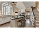 Bright kitchen with granite countertops, stainless steel appliances and large arched window at 865 Mount Katahdin Trl, Johns Creek, GA 30022