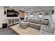 Comfortable living room featuring a large sectional sofa, fireplace, and entertainment center at 865 Mount Katahdin Trl, Johns Creek, GA 30022