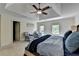 Spacious main bedroom with a trey ceiling, ceiling fan, and large windows at 865 Mount Katahdin Trl, Johns Creek, GA 30022