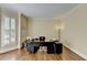 Cozy home office with hardwood floors, natural light, and a functional workspace at 865 Mount Katahdin Trl, Johns Creek, GA 30022