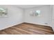 Bright bedroom with wood-look floors, neutral walls and two windows providing ample natural light at 2876 Wendwood Dr, Marietta, GA 30062