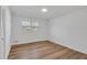 Bright bedroom with wood-look floors, neutral walls and a window providing ample natural light at 2876 Wendwood Dr, Marietta, GA 30062