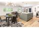 Open-concept kitchen with island, stainless appliances and a view into the living space at 2876 Wendwood Dr, Marietta, GA 30062