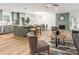 Open-concept living space features a fireplace, modern decor and access to the kitchen at 2876 Wendwood Dr, Marietta, GA 30062