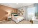 Comfortable bedroom with a large window and stylish curtains, offering natural light at 354 Friendship Oak Way, Hampton, GA 30228
