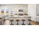 Modern kitchen with granite countertops, stainless steel appliances, and island with seating at 354 Friendship Oak Way, Hampton, GA 30228