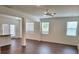 An expansive open concept living room featuring hardwood floors, recessed lights, and patio access at 354 Friendship Oak Way, Hampton, GA 30228