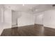 An empty living room with hardwood floors, recessed lighting, and a large, open space at 354 Friendship Oak Way, Hampton, GA 30228