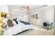 Comfortable bedroom features a tray ceiling, sitting area, and ensuite bathroom at 354 Friendship Oak Way, Hampton, GA 30228