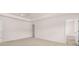 A large, open main bedroom features plush carpeting and an ensuite bathroom for ultimate privacy at 354 Friendship Oak Way, Hampton, GA 30228
