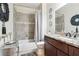 Charming bathroom featuring a granite-topped vanity and a tiled shower/tub combo at 3613 Lake Estates Way, Atlanta, GA 30349