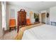 Bright bedroom with a four-poster bed, dresser, and orange chairs, offering a comfortable retreat at 3613 Lake Estates Way, Atlanta, GA 30349