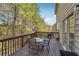 Outdoor deck featuring a dining table and chair set, perfect for outdoor entertaining and relaxation at 3613 Lake Estates Way, Atlanta, GA 30349