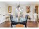 Bright dining area with hardwood floors and natural light, perfect for cozy meals and entertaining guests at 3613 Lake Estates Way, Atlanta, GA 30349