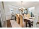 Formal dining room featuring modern chandelier, buffet, and decorative rug at 3613 Lake Estates Way, Atlanta, GA 30349
