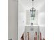 Bright foyer with high ceilings, stylish lighting, and a view of the front door at 3613 Lake Estates Way, Atlanta, GA 30349