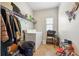 Functional laundry room with washer, dryer, shelving and natural light from the window at 3613 Lake Estates Way, Atlanta, GA 30349