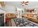 Living room with fireplace, hardwood floors, neutral colors, and open layout to kitchen at 3613 Lake Estates Way, Atlanta, GA 30349