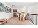 Loft area featuring art and decorations, with natural light and a cozy carpeted space at 3613 Lake Estates Way, Atlanta, GA 30349
