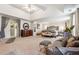 An expansive and inviting main bedroom features a tray ceiling, large windows, and plush carpeting at 3613 Lake Estates Way, Atlanta, GA 30349