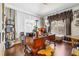 Cozy home office space with a large desk, shelving, and natural light streaming through the window at 3613 Lake Estates Way, Atlanta, GA 30349