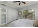 Bright bedroom with a queen-size bed, neutral decor, and a window overlooking the backyard at 3636 Habersham Nw Rd # 2103, Atlanta, GA 30305