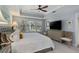 Bright, airy bedroom with a ceiling fan and a dresser with TV at 3636 Habersham Nw Rd # 2103, Atlanta, GA 30305