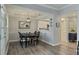 Charming dining room featuring dark wood floors and access to the kitchen at 3636 Habersham Nw Rd # 2103, Atlanta, GA 30305