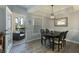 Dining room has a modern light fixture and a view of an outdoor patio at 3636 Habersham Nw Rd # 2103, Atlanta, GA 30305