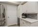 Bright kitchen featuring white cabinets, a stainless steel refrigerator, and counter appliances at 3636 Habersham Nw Rd # 2103, Atlanta, GA 30305
