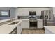 Bright kitchen featuring white cabinets, stainless steel appliances, and sleek countertops at 3636 Habersham Nw Rd # 2103, Atlanta, GA 30305
