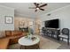 Open-concept living room with a view of the dining area and a large television at 3636 Habersham Nw Rd # 2103, Atlanta, GA 30305