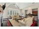 Bright lounge area featuring couches, a bar, and large windows for ample natural light at 3636 Habersham Nw Rd # 2103, Atlanta, GA 30305