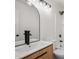 Stylish bathroom with updated lighting and modern fixtures at 6244 Marbut Farms Trl, Lithonia, GA 30058