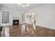 Spacious living room with hardwood floors, a fireplace, and plenty of natural light at 6244 Marbut Farms Trl, Lithonia, GA 30058