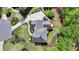 Aerial view of home with meticulously landscaped grounds and outdoor entertaining spaces at 955 Bishopswood Pl, Johns Creek, GA 30022
