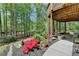 Landscaped backyard, featuring mature trees, flowering shrubs and a patio at 955 Bishopswood Pl, Johns Creek, GA 30022